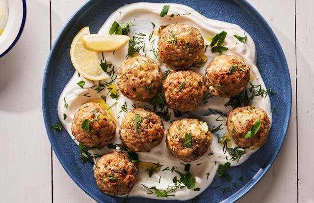 Turkey Feta Meatballs - Delish.com turkey feta meatballs over a lemon yogurt sauce