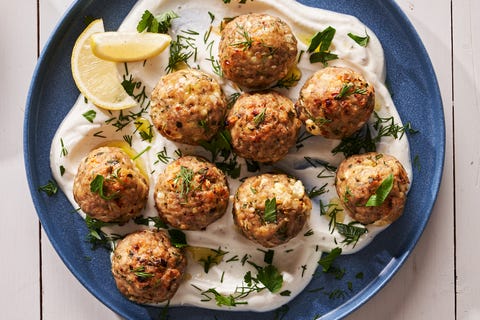 Turkey Feta Meatballs - Delish.com turkey feta meatballs over a lemon yogurt sauce