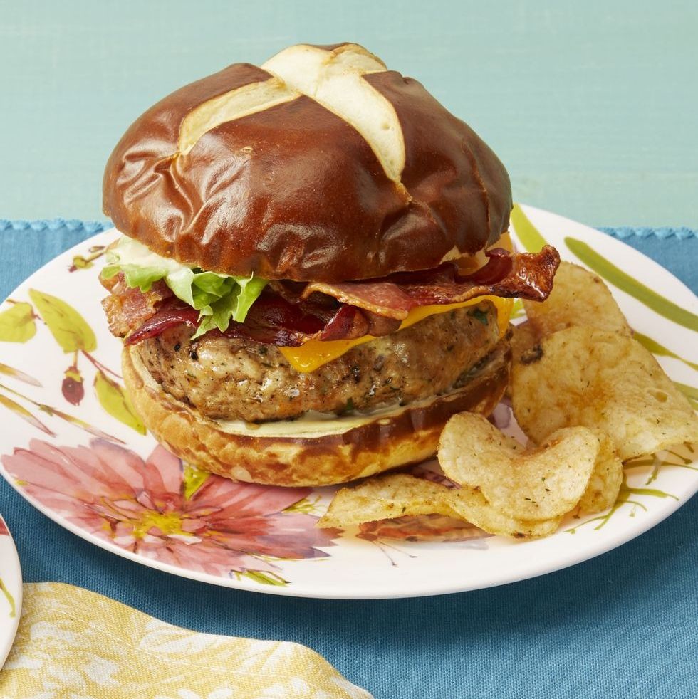ranch turkey burgers with bacon and potato chips on pretzel bun