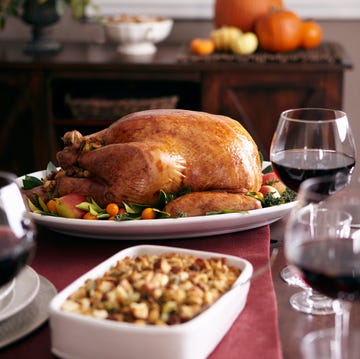 turkey, stuffing, and cranberry dishes on table
