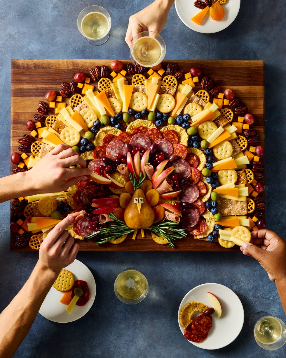 charcuterie board shaped like a turkey