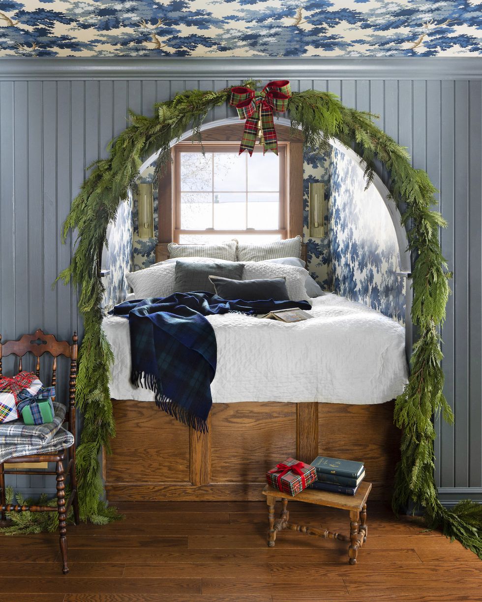 stefanie and scott turner's williamston, michigan farmhouse blue and white bed nook decorated with garland