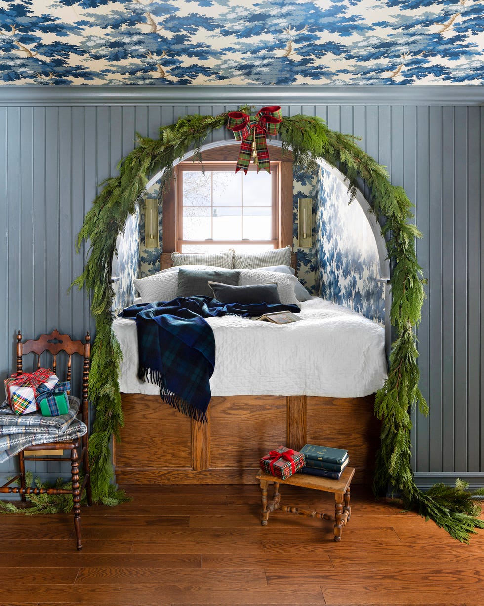 stefanie and scott turner's williamston, michigan farmhouse blue and white bed nook decorated with garland