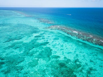 turquoise lagoon and barrier reef, grand cayman, cayman islands