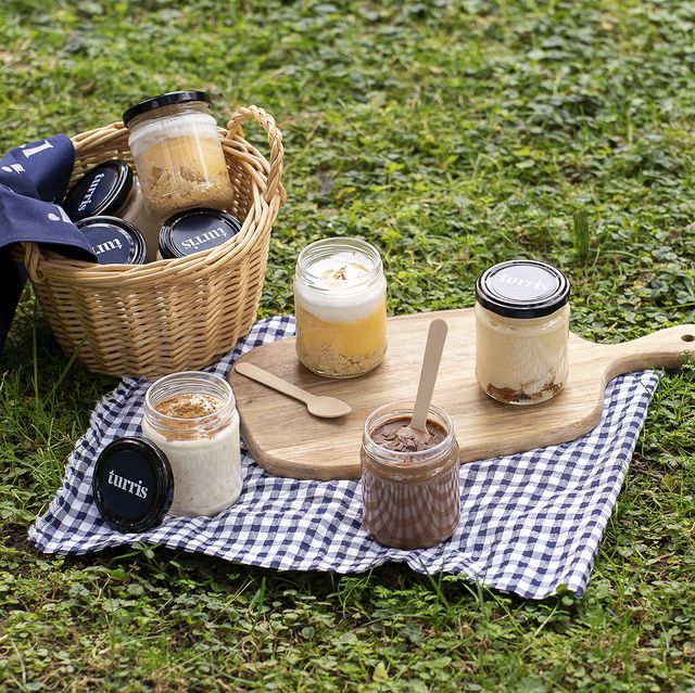 a picnic table with a basket of food and a basket of food