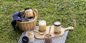 a picnic table with a basket of food and a basket of food