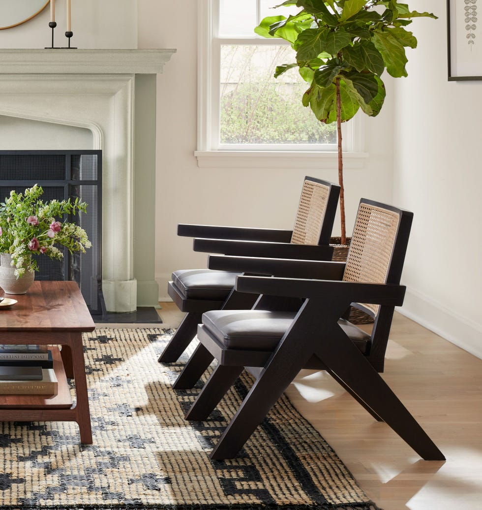 a chair and a table in a room with a fireplace