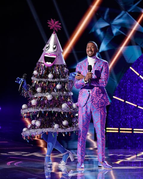 the masked singer l r the tree and host nick cannon in the all new mask us anything episode of the masked singer airing wednesday, nov 6 800 900 pm etpt on fox   photo by fox via getty images