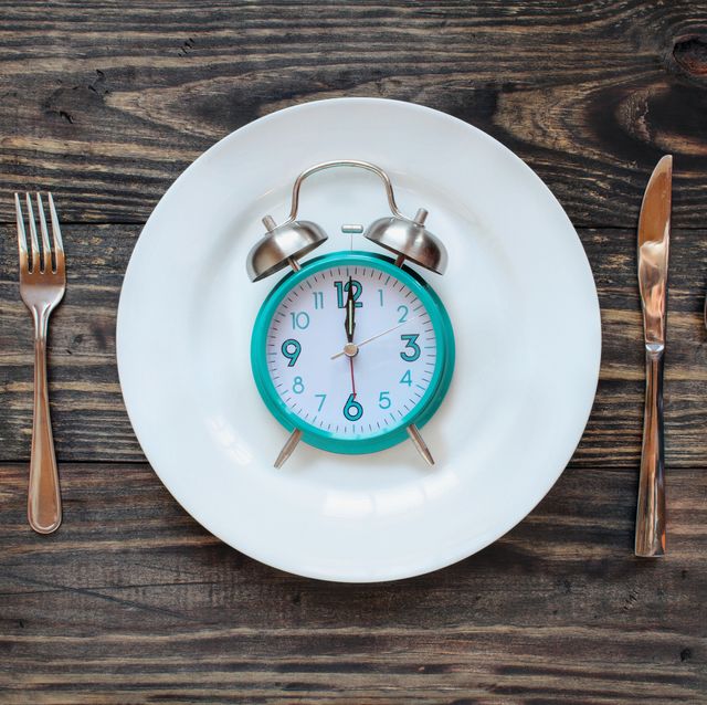 Twelve hour intermittent fasting time concept with clock on plate