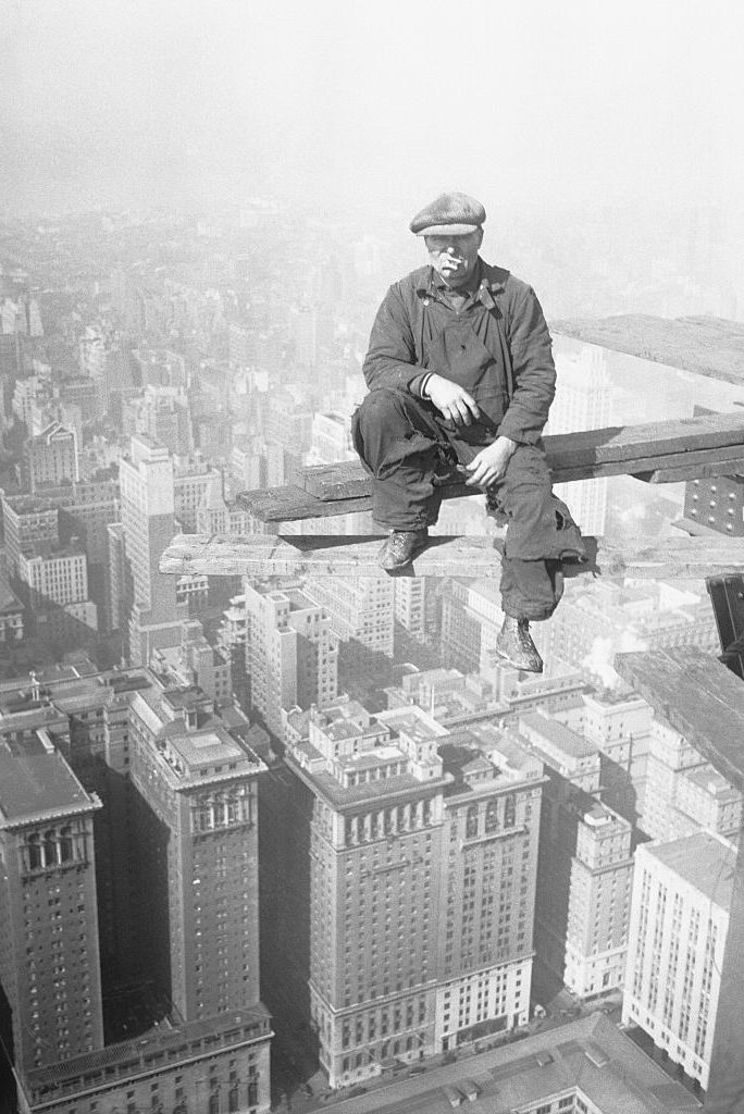 architectural worker on skyscraper beam