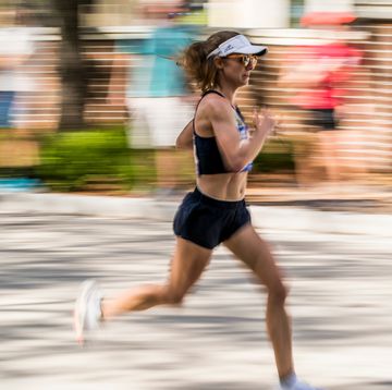 a woman running on a street