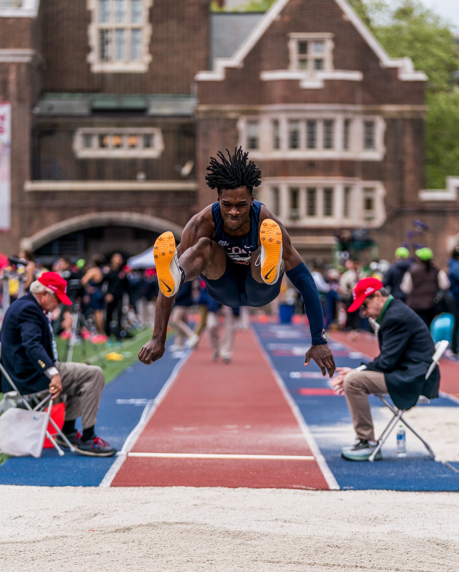RWD a man competing in a long jump competition