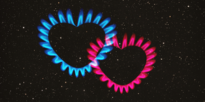 a pink and a blue heart made out of flames are placed in a starry sky