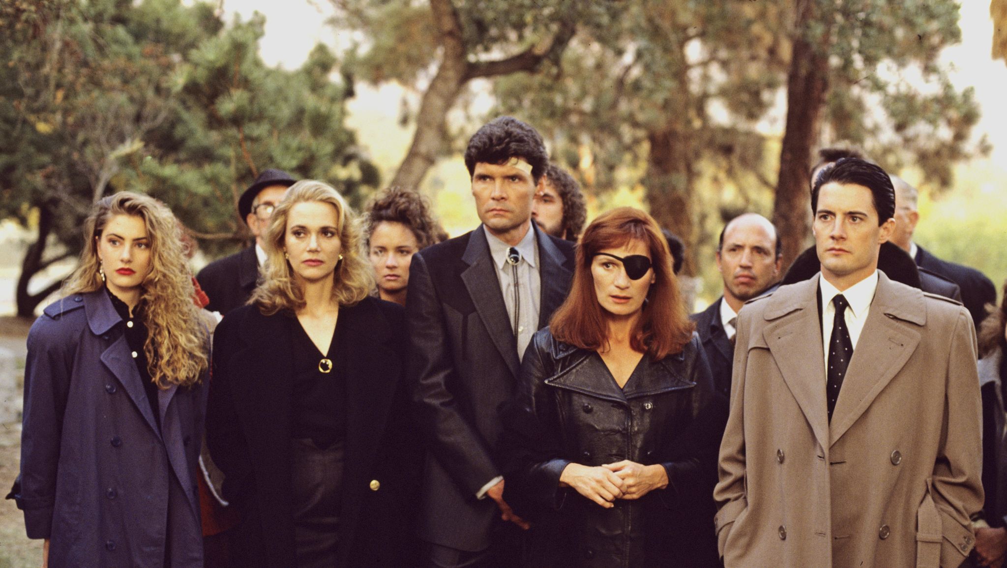 united states   april 26  twin peaks   episode three   season one   4261990, fbi special agent dale cooper kyle maclaughlin, right at former homecoming queen laura palmers funeral with a lineup of mournerssuspects, from left shelly johnson madchen amick, norma jennings peggy lipton, ed hurley everett mcgill and nadine hurley wendy robie,  photo by walt disney television via getty images photo archiveswalt disney television via getty images