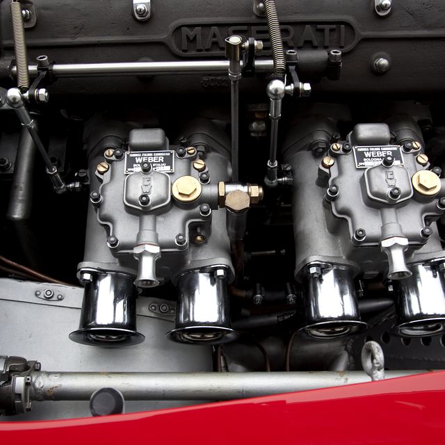 Twin Weber twin carburetor's on a Maserati 250S engine with side draft.