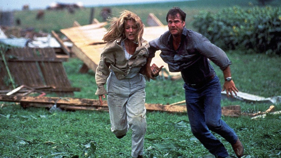 a man and woman running from a storm a man and woman running from a storm