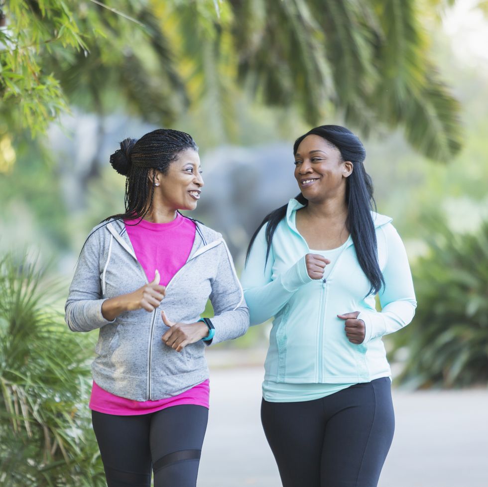 two african american women jogging together