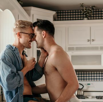 two american caucasian lgbtqi men in cottage kitchen, coffeyville, united states