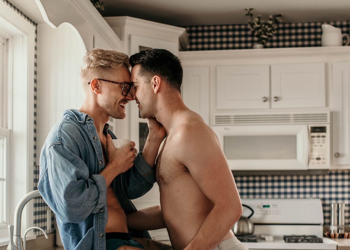 two american caucasian lgbtqi men in cottage kitchen, coffeyville, united states