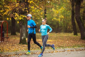 two athlete running in nature