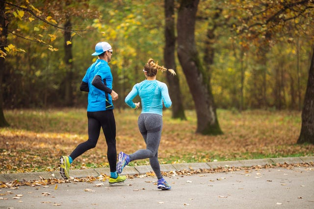 two athlete running in nature