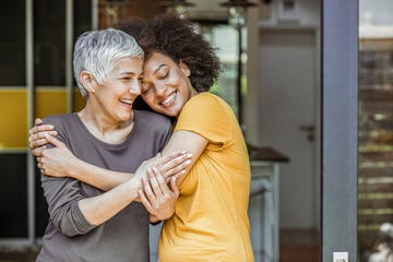 two beautiful woman embracing