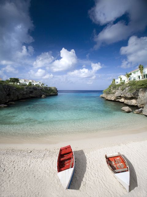 two boats on a beach in curacao
