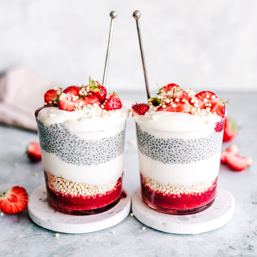 two chia pudding cups with coconut yogurt, strawberry and puffed quinoa