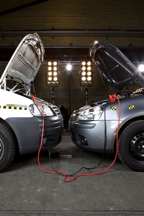 Two crash test cars with jumper cables