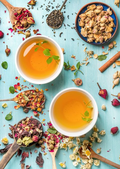 Two cups of healthy herbal tea with mint, cinnamon, dried