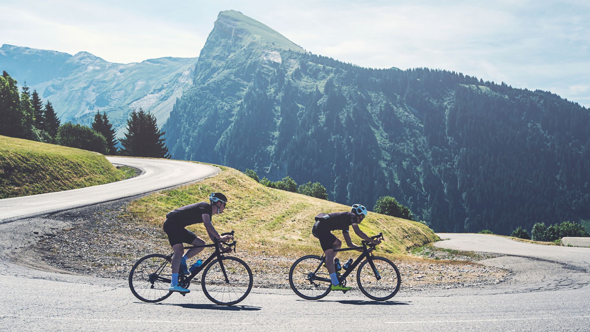 two cyclists on a descent