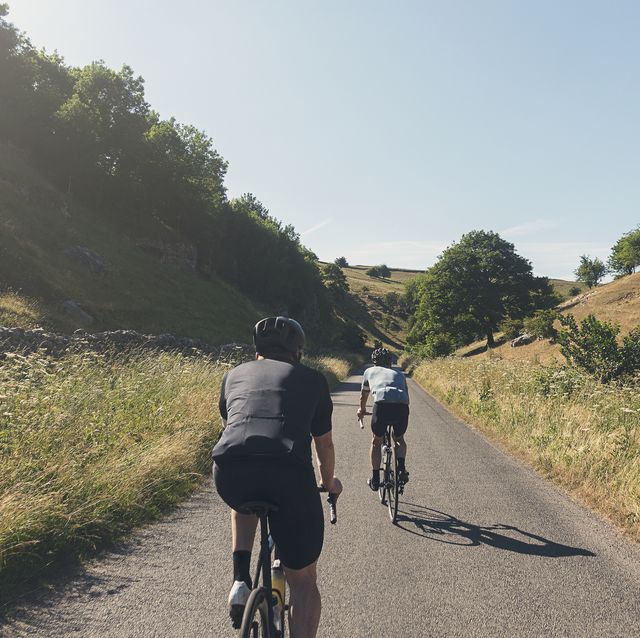 two cyclists in peak district, uk