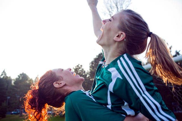 two female friends cheering