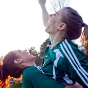 Two female friends cheering two female friends cheering