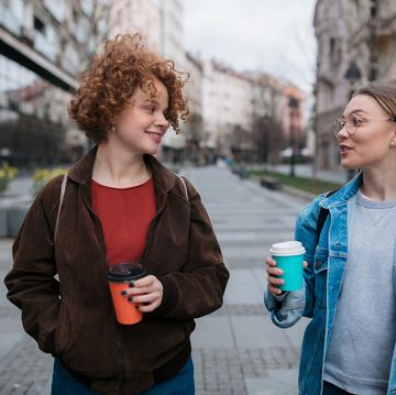 two female friends walking through the city
