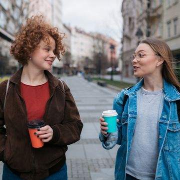 two female friends walking through the city