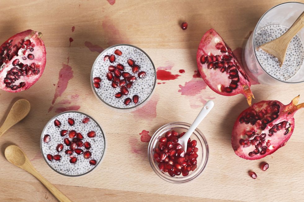 Two glasses of chia pudding with pomegranate seed