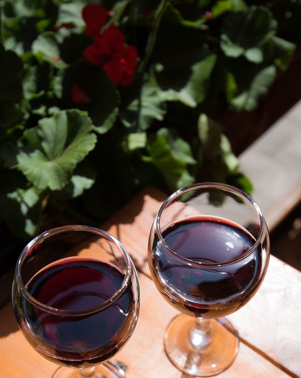 two glasses of red wine on the vibrant restaurant background. selective focus.