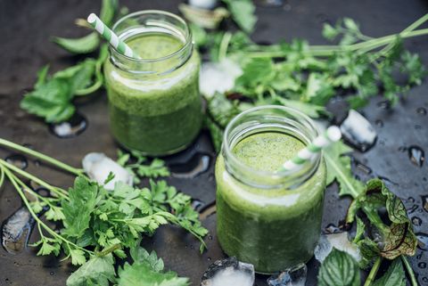 Two glasses of wild herb smoothie with apple, banana and lime juice