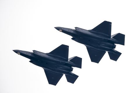 Two Lockheed Martin F-35 Lightning II fly during a military...