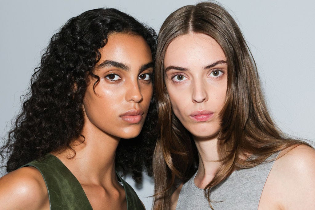 two models backstage at fashion week