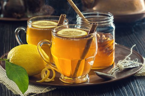 two mugs of lemon spice herbal tea or hot low calorie alcoholic drinks   hot toddy