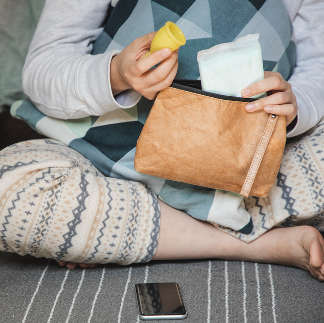 woman looks at sanitary products