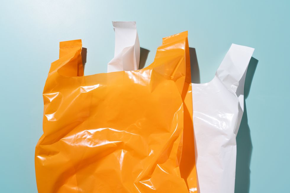 two plastic bags overlapped on blue