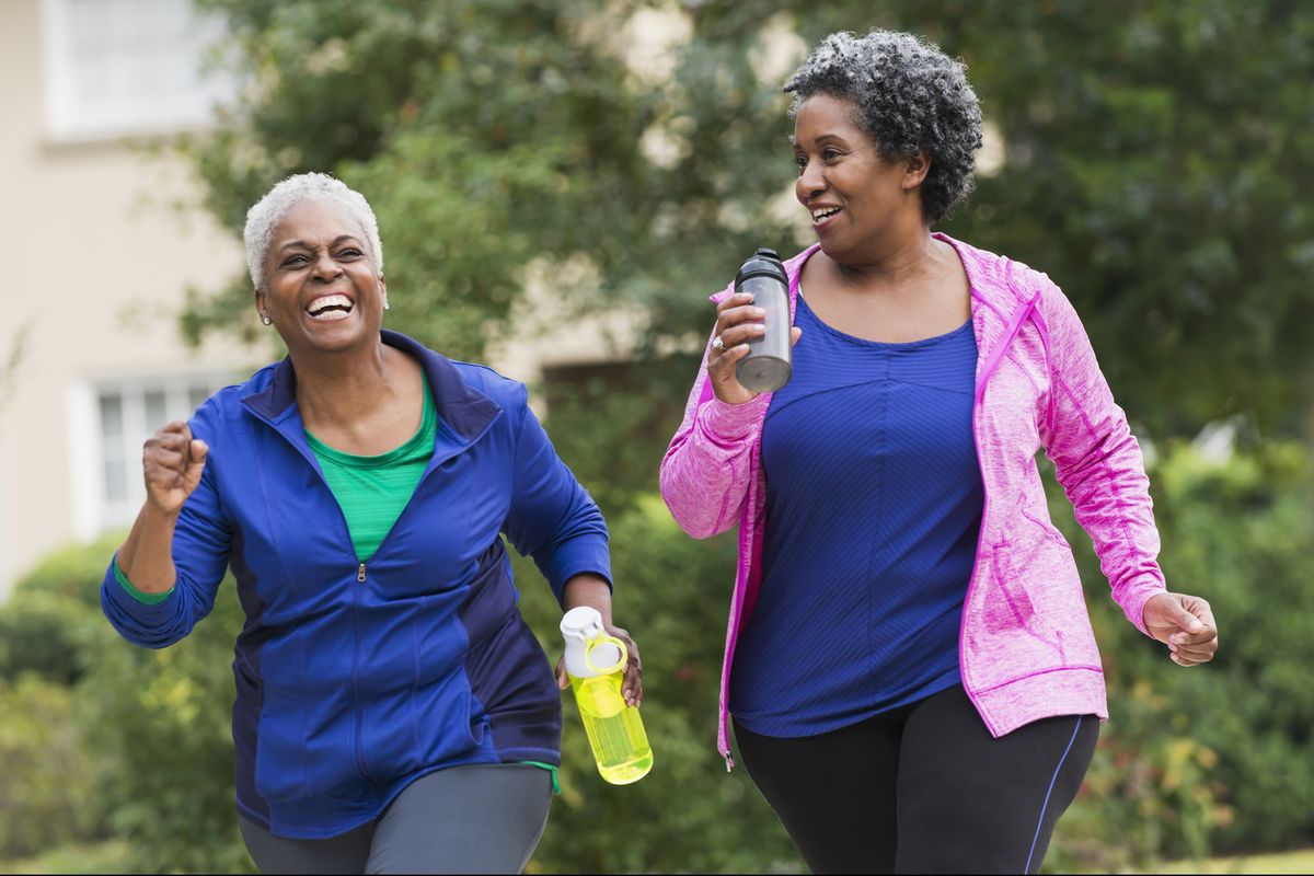 Two senior black women exercising together