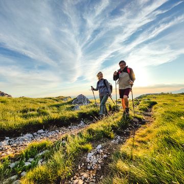 two seniors hiking and walking off the beaten path