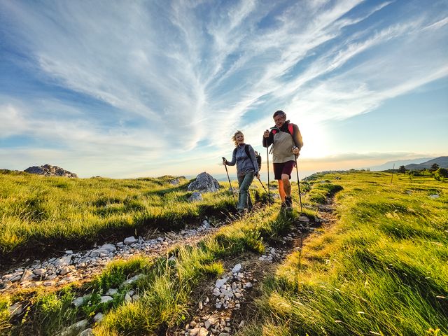 two seniors hiking and walking off the beaten path