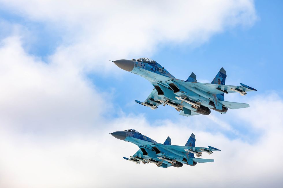 two su 27 fighters fly over a military base in the zhytomyr