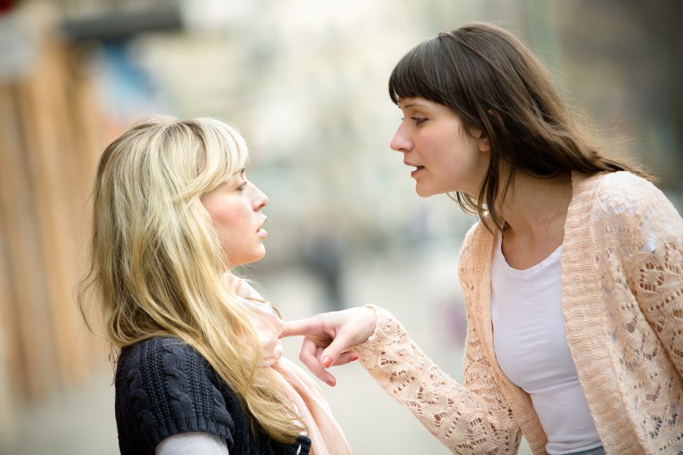 two women arguing on the street
