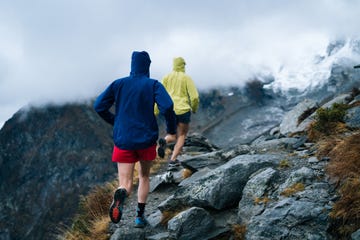 two women run through the swiss alps in early autumn